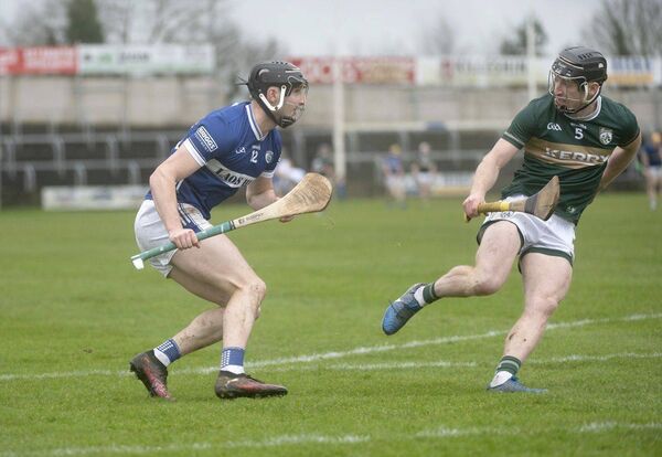 Laois's Aaron Dunphy gives Kerry's James O'Connor the slip in Laois Hire O'Moore park on Saturday Photo: Denis Byrne
