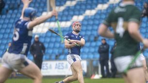 <p>Laois's David Dooley keeping watch as his shot splits the posts in their third round NHL defeat of Kerry at Laois Hire O'Moore Park on Saturday Photos: Denis Byrne</p> <p>Laois's David Dooley keeping watch as his shot splits the posts in their third round NHL defeat of Kerry at Laois Hire O'Moore Park on Saturday Photos: Denis Byrne</p>