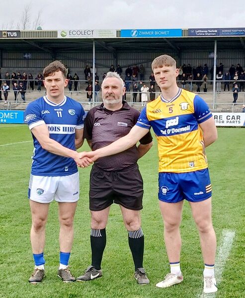 Captain Brian Byrne (Laois) and ; Dermot Coughlan (Clare) with referee James Molloy prior to throw-in at Ennis on Sunday 