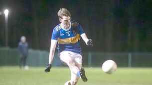 <p>Joe Lennon (O'Dempsey's) playing this ball against St Joseph's Photo: Denis Byrne</p>