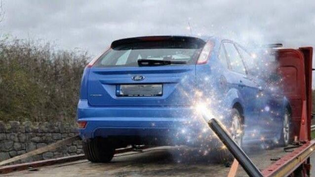 <p>The Ford Focus was seized and towed away in Rathdowney. Photo: An Garda Síochána Laois Offaly</p>