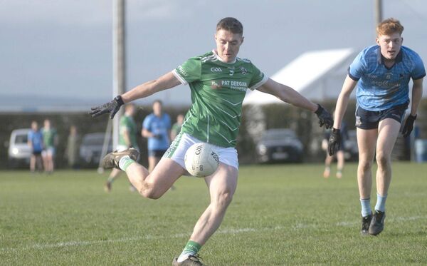 Stradbally's Eoin Buggy goes for a score against Ballyroan Abbey 	 Photo: Denis Byrne