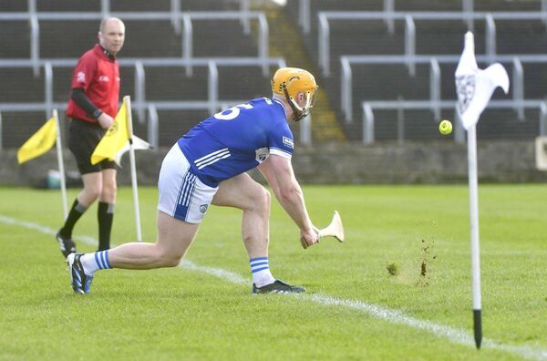 Laois's Padraig Delaney sends this sideline cut into the danger area Photo: Denis Byrne Laois's Padraig Delaney sends this sideline cut into the danger area Photo: Denis Byrne