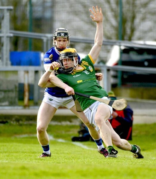 Laois's Cody Comerford ensures Meath's Lorcan Byrne is not going to progress very far Photo: Denis Byrne Laois's Cody Comerford ensures Meath's Lorcan Byrne is not going to progress very far Photo: Denis Byrne