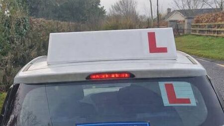 Driving instructor caught using phone behind the wheel