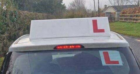 Driving instructor caught using phone behind the wheel