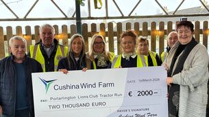 <p>Members of the Portarlington Lions Club hold a cheque for €2,000 from Irish renewable energy company, Galetech Group </p>