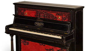 Piano John Lennon used to write Beatles songs fetches record amount at auction