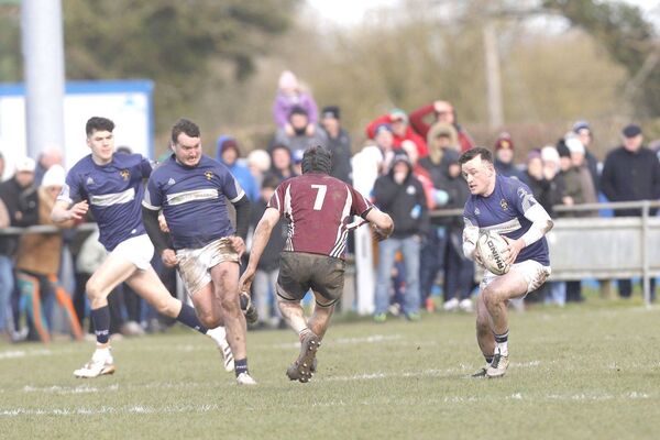 Portlaoise's Bryan Croke steps inside Roscrea's Andrew Hodgins with Oisin Hade and Liam Doyle in close support Photo: David Maher Portlaoise's Bryan Croke steps inside Roscrea's Andrew Hodgins with Oisin Hade and Liam Doyle in close support Photo: David Maher