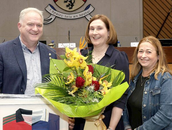 Sue Ramsbottom accepting presentations from Timahoe Ladies Football Club - Tom Mc Kittrick (Chairperson) and Eavonne Donoghue (Secretary)