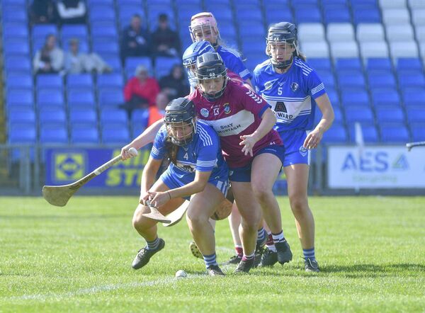 Fiona Scully (Laois) moving to win possession of this sliotar with Sheila McGrath (Westmeath) at her back Photo: Denis Byrne