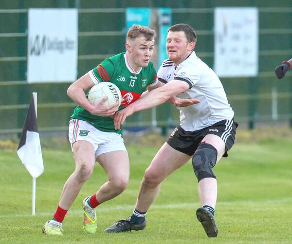 Graiguecullen's Jamie O'Brien hold off this challenge in their drawn ACFL Division 1 game against Arles Killeen on Saturday Photo: Paul Dargan