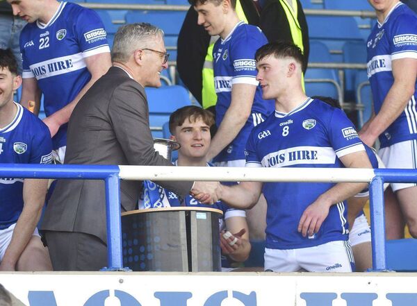 GAA President Jarlath Burns presents Laois captain David Dooley with the Allianz Division 2 League Cup on Saturday Photo Denis Byrne