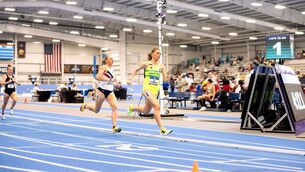 <p>Ava O'Connor approaches the finish line in the mile race at the NCAA Championships</p>