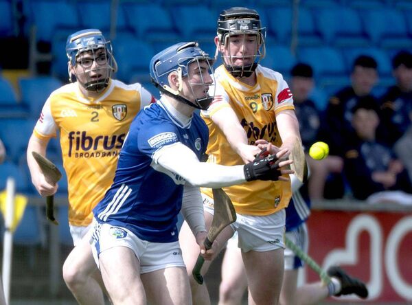 Luke Hynes (Laois) laying this sliotar off against Antrim Photo: Denis Byrne