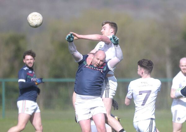 Sean O'Flynn (Courtwood) competes with John Rigney (Clonaslee/St Manman's) for this breaking ball Photo: Denis Byrne