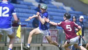 <p>Jamie Mahony (Laois) gets past the outstretched hand of Galway's Cathal Donoghue Photo: Denis Byrne</p>