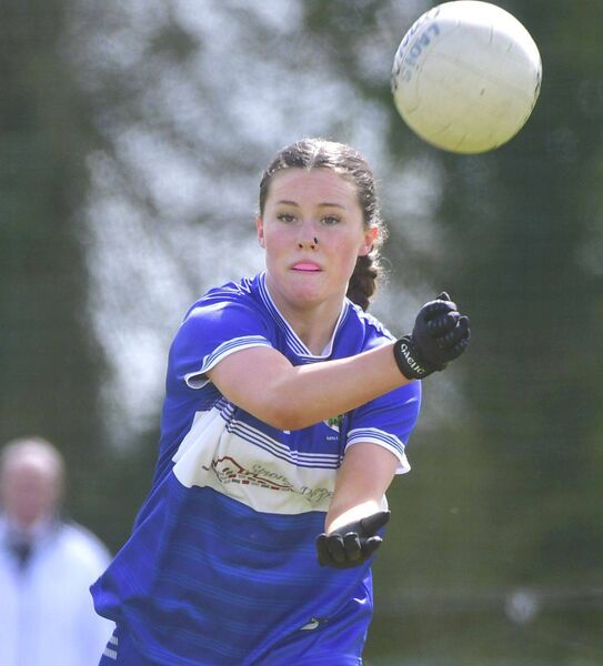 Aine Carter (Laois) releasing this ball against Kildare Photo: Denis Byrne