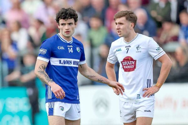 Laois's Dargah Galvin gets ready to shake off the attention of Kildare's Tommy Gill Photo: Paul Dargan