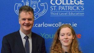 <p>Former Portlaoise College student Amy Kenny with Noel Daly, Principal of the college </p>