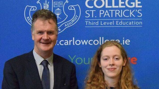 <p>Former Portlaoise College student Amy Kenny with Noel Daly, Principal of the college </p>