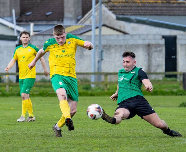 Hanover's Luke Murphy makes a strong challenge on Crettyard’s Jack Brady Photo: Michael O'Rourke 