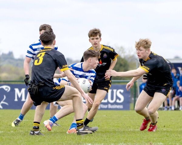 Mikey Regan for Knockbeg finds himself surrounded by Navan players Mikey Regan for Knockbeg finds himself surrounded by Navan players