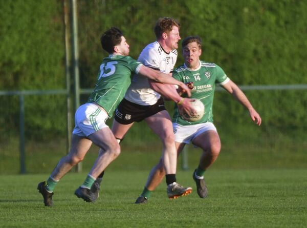 Michael Wall, Arles Killeen looking to release this ball as Fionn McEvoy and David Dineen, Stradbally challenge Photo: Denis Byrne