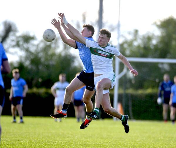 Conaire Gee (Ballyroan Abbey) and Ben Brennan (Portlaoise) compete for this ball in their ACFL Division 1 game Photo: Denis Byrne