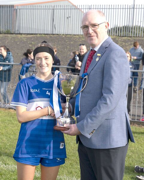 Laois captain Sarah McDonald receives the Leinster Minor 'B' Cup from Arthur Corrigan 	 Photo: Aisling Hyland