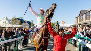 <p> Paul Townend celebrates winning the Ladbrokes Punchestown Gold Cup with Gaelic Warrior Photo: ©INPHO/Morgan Treacy</p>