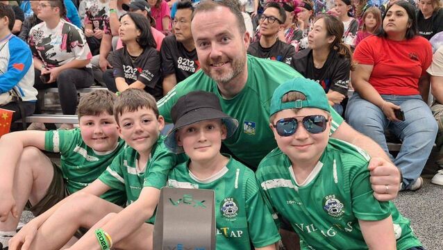 <p>Principal Rory Walsh with some of the RNS Robotics team at the Vex Robotics World Championships in the USA</p>