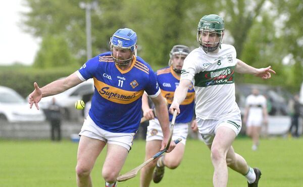 Sean Corby (Clough/Ballacolla) about to secure this sliotar as Conor Raggett (Portlaoise) looks to get a touch Photo: Denis Byrne