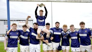 <p>Portlaoise captain Mark Kelly is raised shoulder high after the team won the Michael Dunne Cup final after getting the better Carlow on Sunday in Athy Photo Martin Rowe </p>