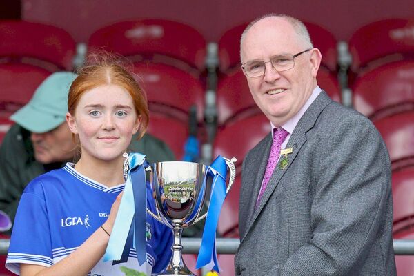 Laois captain Lucy Whelan is presented with the Leinster LGFA U/16 'B' trophy after beating Dublin Photo: Paul Dargan