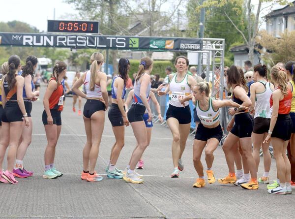 Cheryl and Maisy changing over in the National Road Relays