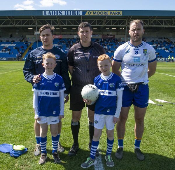 Captains Brian Byrne (Laois) and Dean Healy (Wicklow) with Referee Barry Tiernan and Laois Mascots Henry and Arthur. All Photos: Denis Byrne.