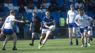 <p>Laois's Paddy O'Sullivan in space and looking to release the ball. Photos: Denis Byrne.</p>