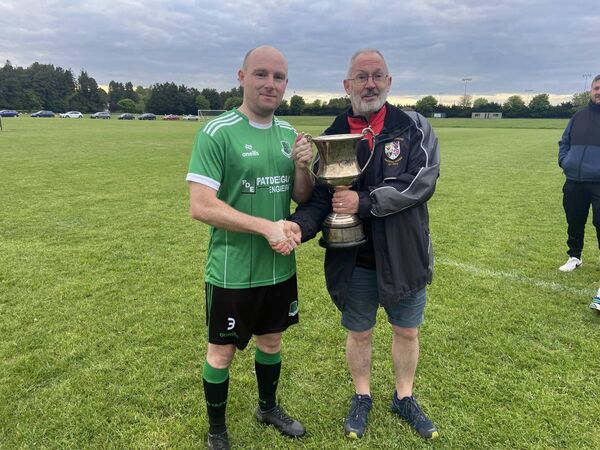Stradbally Town captain Podge Fitzpatrick is presented with the CCFL Division 3 championship. Stradbally Town captain Podge Fitzpatrick is presented with the CCFL Division 3 championship.