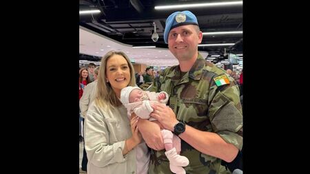 Soldier meets newborn daughter for first time at Dublin Airport