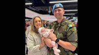 Soldier meets newborn daughter for first time at Dublin Airport 