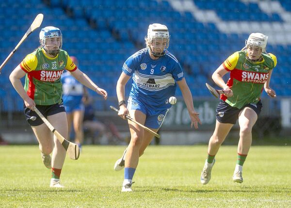Laois's Jade Bergin breaks away from Carlow's Clodagh Lawler and Sarah Sheehan at Laois Hire O'Moore Park on Sunday Photo: Denis Byrne Laois's Jade Bergin breaks away from Carlow's Clodagh Lawler and Sarah Sheehan at Laois Hire O'Moore Park on Sunday Photo: Denis Byrne