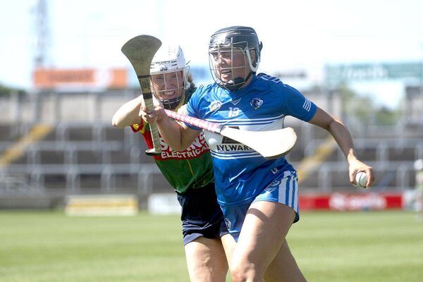 Kirsten Keenan (Laois) retains possession despite this challenge by Carlow's Gillian Doyle Photo: Denis Byrne Kirsten Keenan (Laois) retains possession despite this challenge by Carlow's Gillian Doyle Photo: Denis Byrne