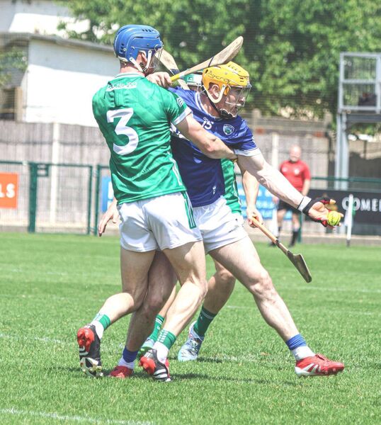 Laois's James Keyes battles to get his pass away Photo courtesy CLG Laois Laois's James Keyes battles to get his pass away Photo courtesy CLG Laois