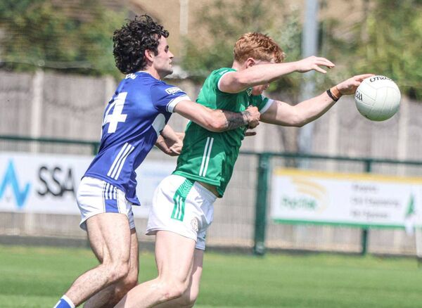 Laois's Daragh Galvin makes sure this ball will not be given up softly to London 	Photo courtesy CLG Laois