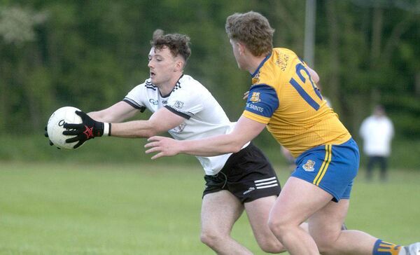 Oisin Byrne (Arles Killeen) gaining possession with Cormac Murphy (St Joseph's) staying close Photo: Denis Byrne Oisin Byrne (Arles Killeen) gaining possession with Cormac Murphy (St Joseph's) staying close Photo: Denis Byrne