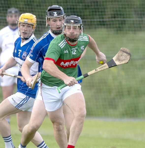 Tadhg Dowling (Rathdowney/Errill) breaks with Ryan Peters (Castletown) staying close Photo: Denis Byrne Tadhg Dowling (Rathdowney/Errill) breaks with Ryan Peters (Castletown) staying close Photo: Denis Byrne