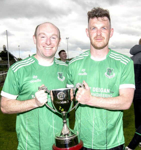 Podge Fitzpatrick and Colin Beale holding the CCFL Division 3 Shield Cup Photo: Denis Byrne