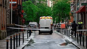 Man held on suspicion of attempted murder after police car driven at officer