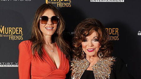 Joan Collins reunites with Elizabeth Hurley on red carpet